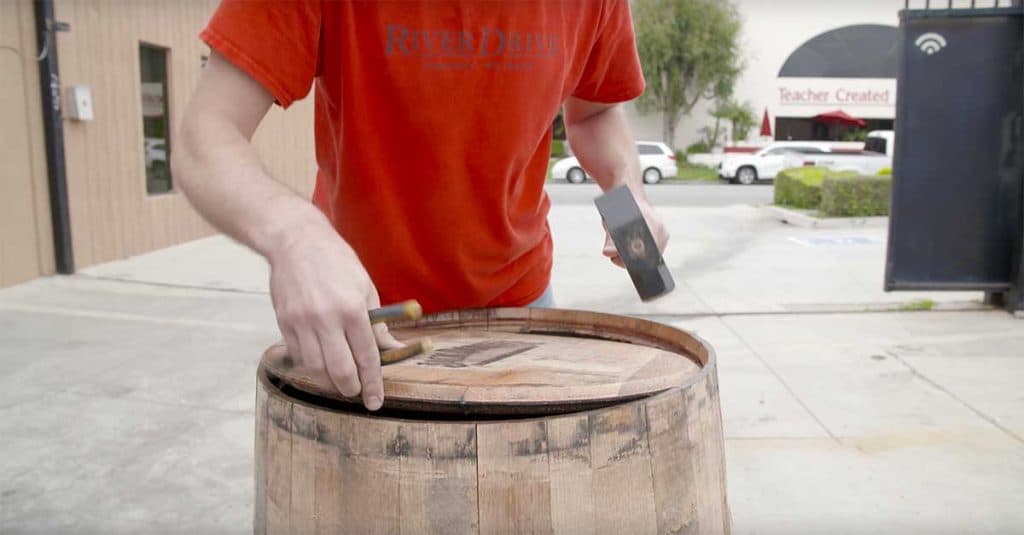 Breaking down whiskey barrel